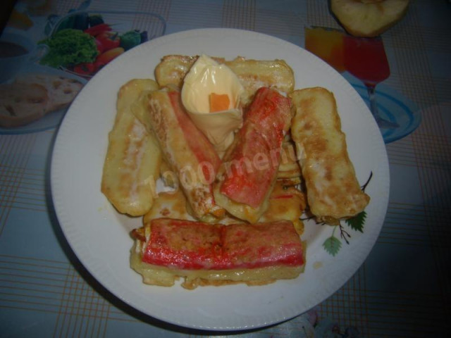 Crab sticks stuffed with carrots in batter