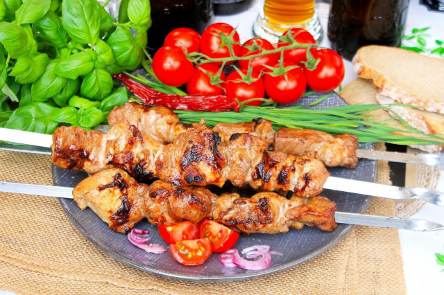 Shish kebab with tomatoes and pork onions