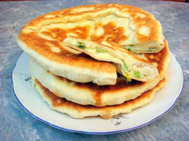 Tbilisi khachapuri with cheese in a frying pan