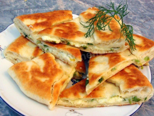 Tbilisi khachapuri with cheese in a frying pan