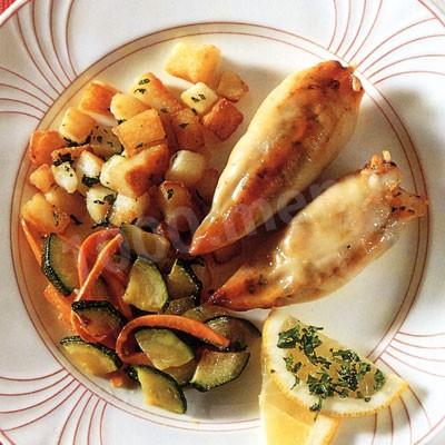 Squid stuffed with fish and vegetables in a frying pan