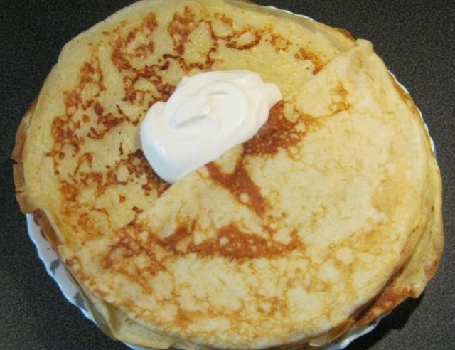 Pancakes with cheese and milk