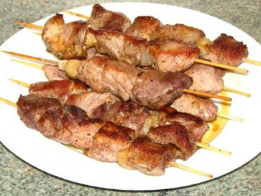 Veal kebab in a frying pan is soft and juicy