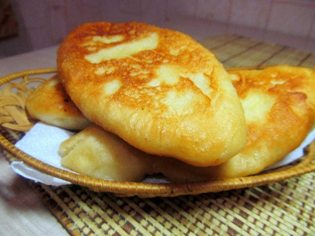 Fried yeast dough pies on potato broth
