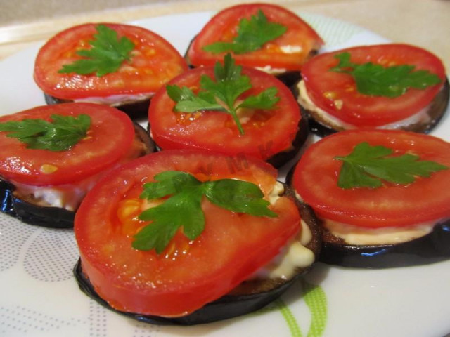Fried eggplant with tomatoes with a turret