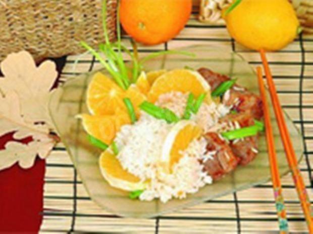 Roast pork with rice and oranges