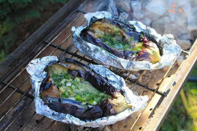 Eggplant in foil on coals