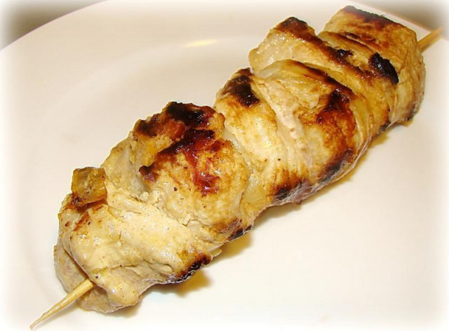 Pork kebab in mayonnaise in a frying pan grill