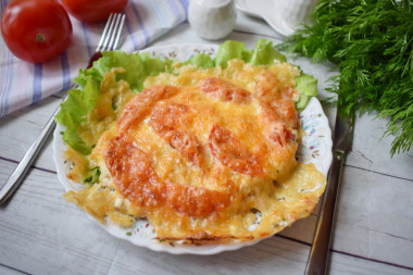 Pork chops baked in the oven with cheese