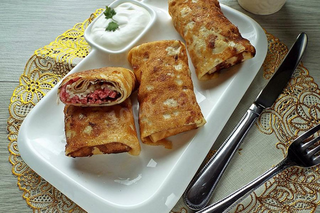 Pancakes with smoked sausage and cheese filling