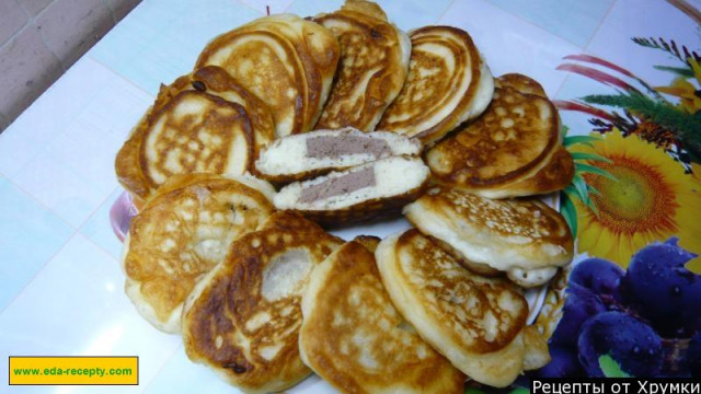 Pancakes with boiled sausage on curdled milk