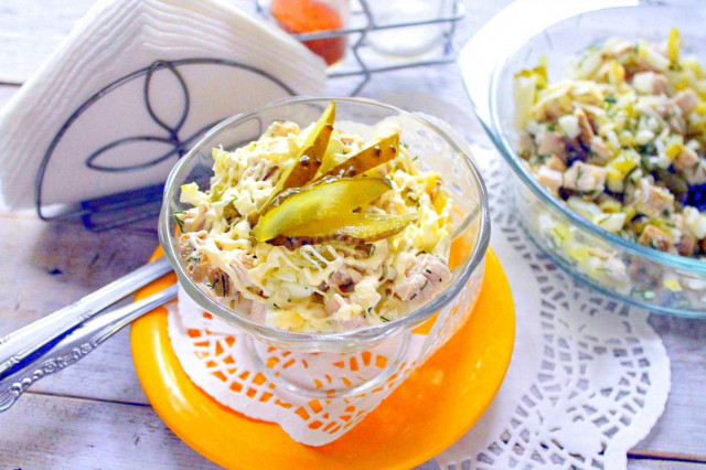 Boiled breast salad with pickled cucumbers and hard cheese