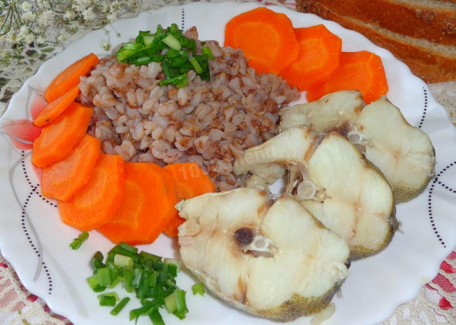 Boiled pollock with carrots and onions