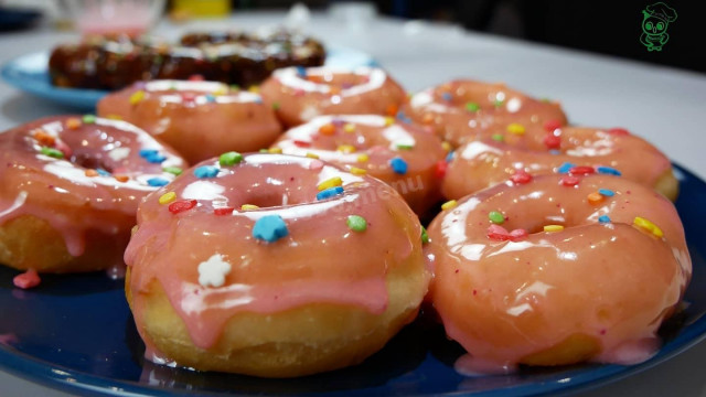Donuts made of yeast dough with sweet white glaze