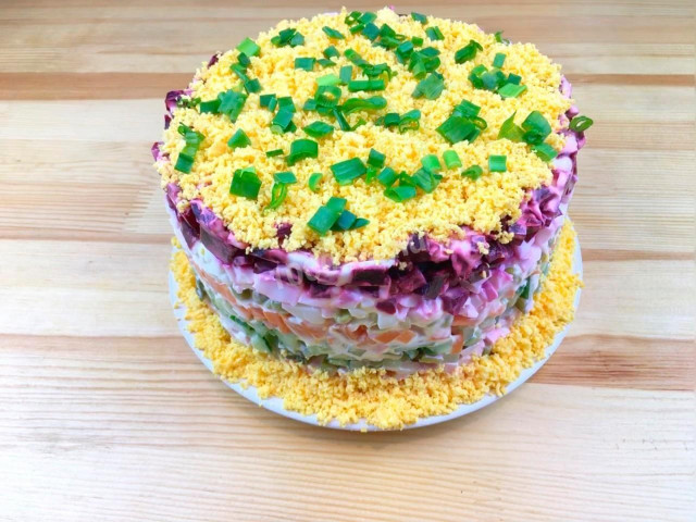 Layered salad Vegetable cake with boiled sausage and potatoes