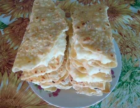Tatar flatbreads with milk with potatoes and herbs