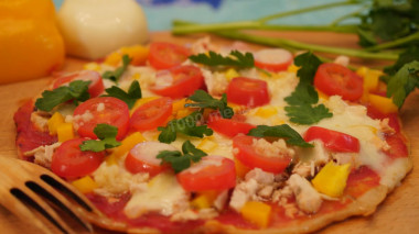Lazy pizza made from kefir dough in a frying pan