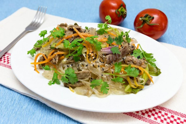 Funchosa with beef, vegetables, soy sauce and ginger