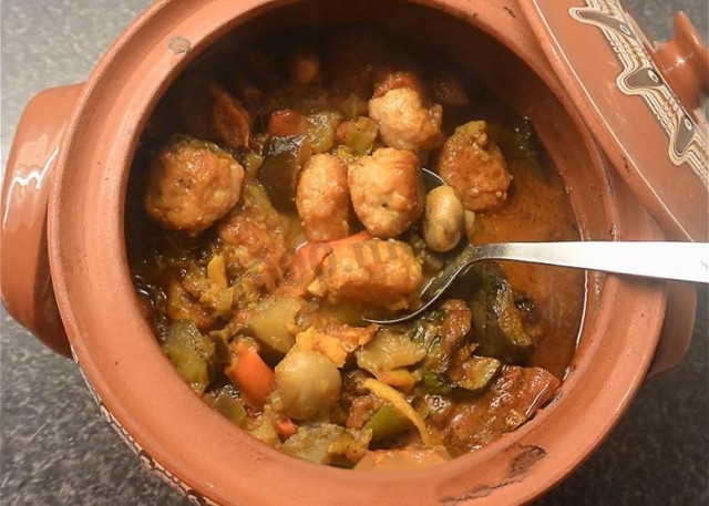Pork meat with potatoes in a pot