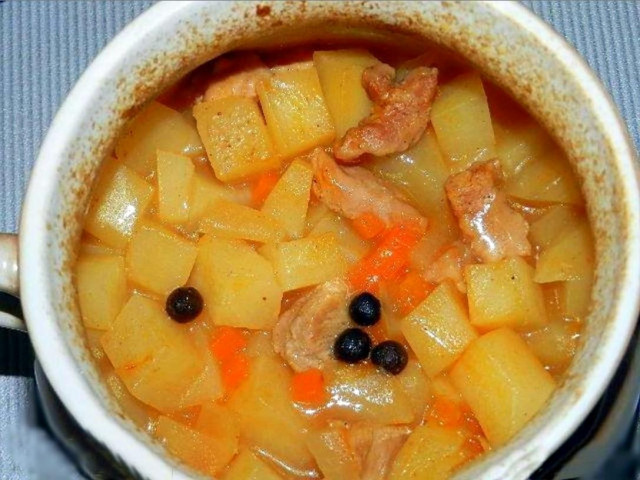 Pork with potatoes in a pot