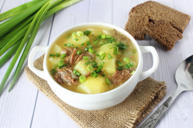 Stewed potatoes with stewed meat in a slow cooker