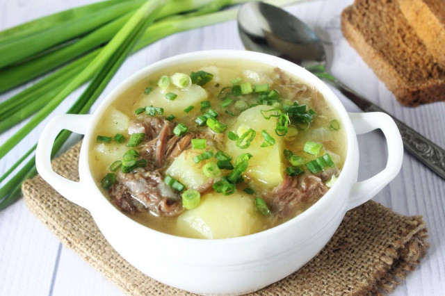 Stewed potatoes with stewed meat in a slow cooker