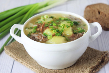 Stewed potatoes with stewed meat in a slow cooker