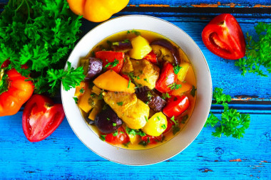 Chicken with vegetables and potatoes in a cauldron