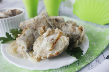 Pollock stewed in milk in a frying pan