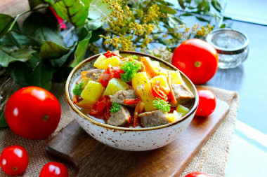 Stewed potatoes with tomatoes and meat