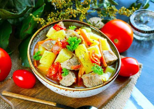 Stewed potatoes with tomatoes and meat