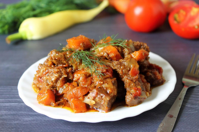 Beef stewed with vegetables in a slow cooker