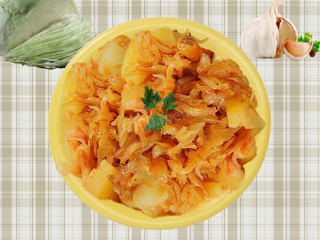 Potatoes with cabbage stewed with tomatoes in a slow cooker
