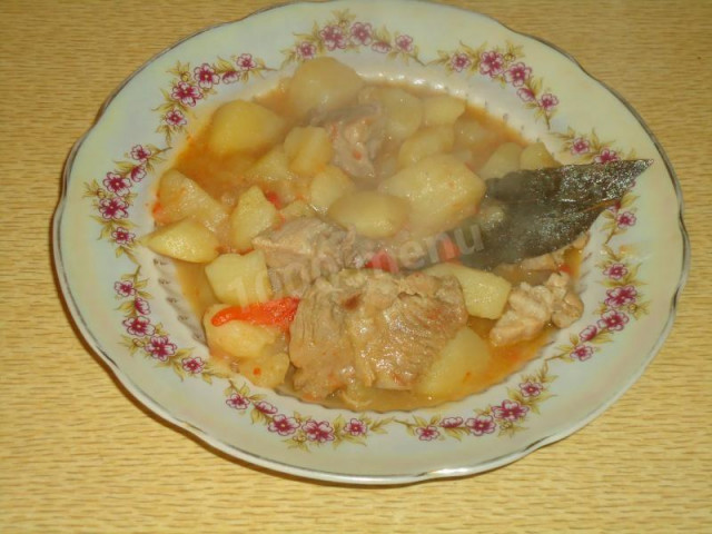 Stewed pork with potatoes, carrots, onions and peppers