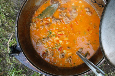 Lagman on a campfire in a cauldron