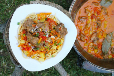 Lagman on a campfire in a cauldron