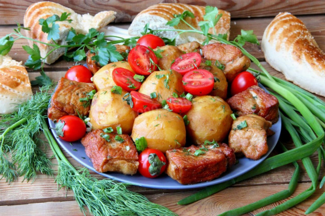 Potatoes with meat in a cauldron