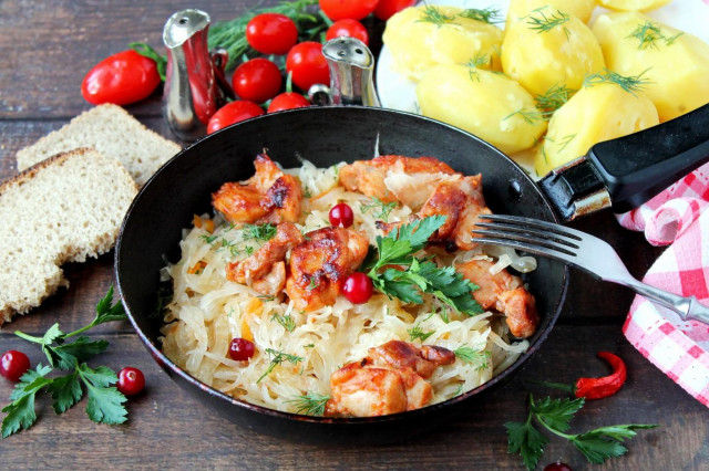 Chicken with sauerkraut in a frying pan