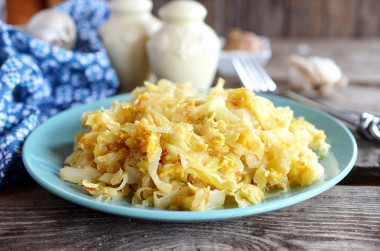 Cabbage with egg fried in a frying pan