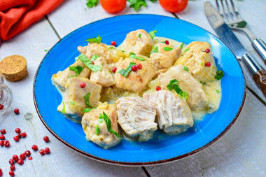 Chicken fillet in sour cream in a frying pan