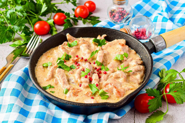 Pork beef stroganoff with gravy in a frying pan