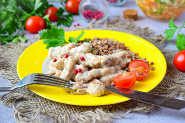 Pork beef stroganoff with gravy in a frying pan