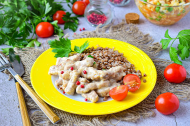 Pork beef stroganoff with gravy in a frying pan