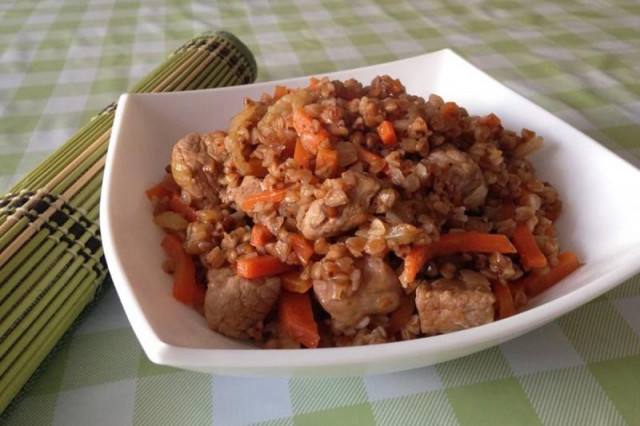 Buckwheat in a merchant's style in a slow cooker with pork