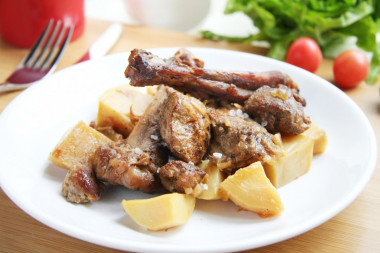 Goose in a slow cooker in pieces with potatoes