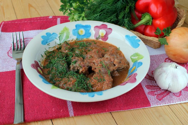 Meat with gravy in a slow cooker