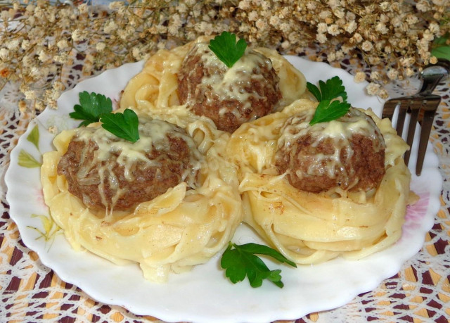 Pasta nests without sauce with rabbit meat and parmesan