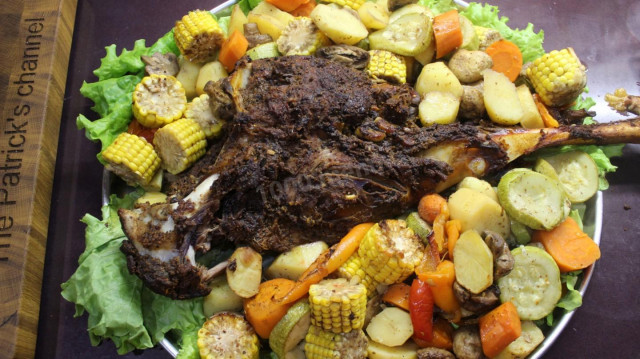 Leg of mutton in oven with vegetables