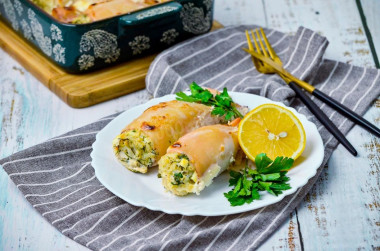 Squid stuffed with rice and egg with sour cream in the oven