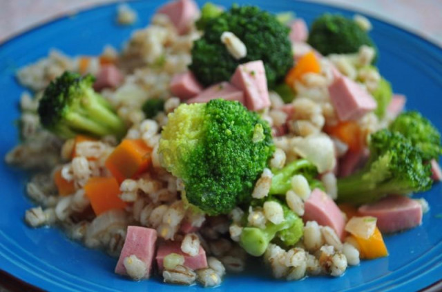 Pearl barley porridge with sausages and vegetables